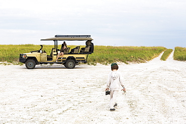 Six year old boy playing with toys, Nxai Pan, Botswana