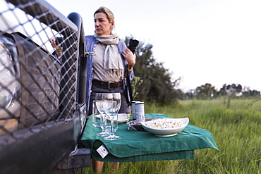 snacks and drinks on fold out table, safari vehicle, Botswana