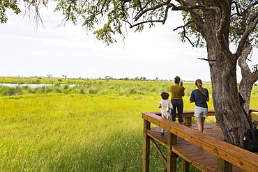 mother and kids at tented camp, Botswana