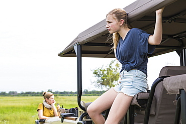 Thirteen year old girl on safari vehicle, Botswana