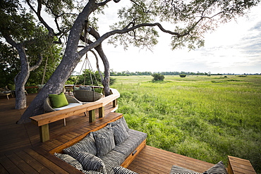 Wooden platform overlooking scenic landscape at a tented safari camp, Botswana