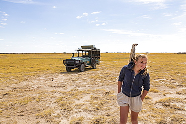 12 year old girl with Meerkat on her head, Kalahari Desert