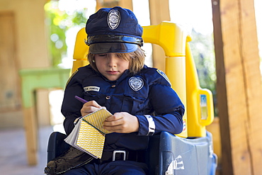 4 year old boy dressed as a police officer