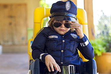 4 year old boy dressed as a police officer