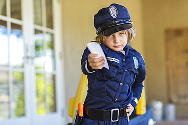 4 year old boy dressed as a police officer