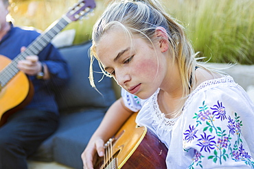 11 year old girl playing guitar