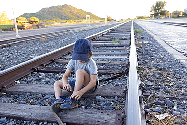 4 year old boy on railroad tracks Lamy, New Mexico