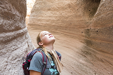 12 year old girl hiking in beautiful slot canyon Kasha Katuwe Tent Rocks, New Mexico