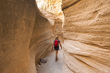 12 year old girl hiking in beautiful slot canyon Kasha Katuwe Tent Rocks, New Mexico