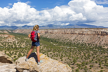 12 year old girl hiking in Tsankawi Runis, New Mexico