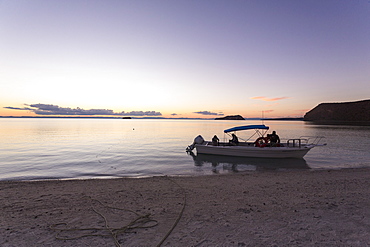 Power boat moored near beach at sunset, Sea of Cortes, Mexico