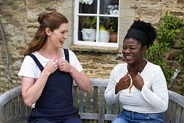 Woman and female therapist talking in a garden