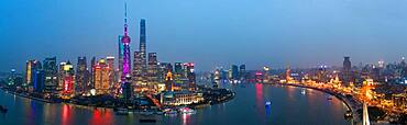 Skyline of the Pudong Financial district across Huangpu River at dusk, Shanghai, China, China