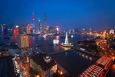 Skyline of the Pudong Financial district across Huangpu River at dusk, Shanghai, China, China