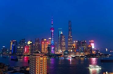 Skyline of the Pudong Financial district across Huangpu River at dusk, Shanghai, China, China