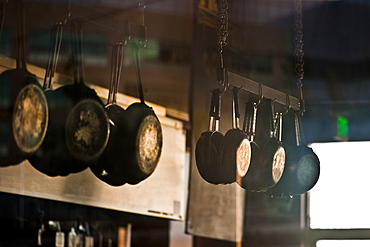 Pans hanging in commerical kitchen