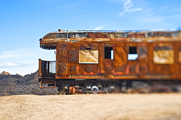 Rusty vintage train carriage in desert