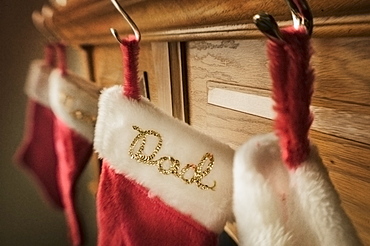 Christmas stockings hanging from a mantelpiece