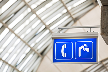 Sign for telephone and drinking fountain in large public building