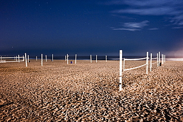 Beach volleyball nets on sand on beach