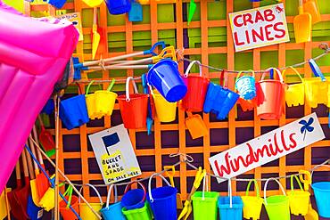 Bucket and spades and other beach items for sale, holiday resort, England, United Kingdom