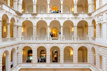 Hotel, a historic building with atrium and walkways, classical architecture, people on each level