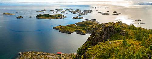 Henningsvaer on Lofoten islands with sheltered harbour and bridges connecting rocky islands, Henningsvaer, Lofoten Islands, Norway