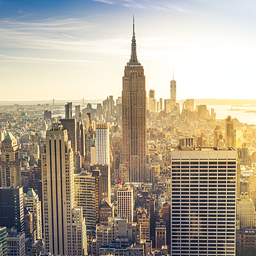 Empire State Building rising above Manhattan skyline.