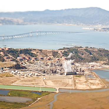 Factory with sea bridge beyond