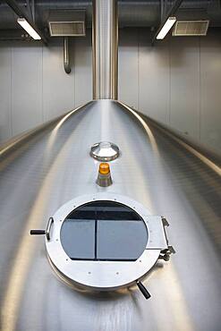 Interior of brewery, large steel storage tanks for brewing beer