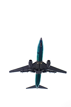 The underside of an aeroplane in flight.