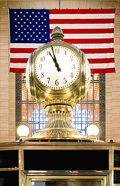 Old Clock in Front of Flag, New York, New York, United States of America