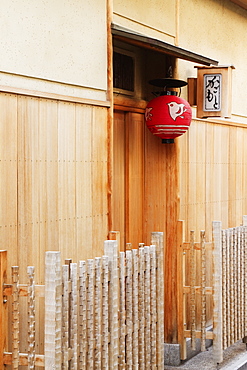 Red Asian Lamp Hanging Outside a Building Door, Kyoto, Japan