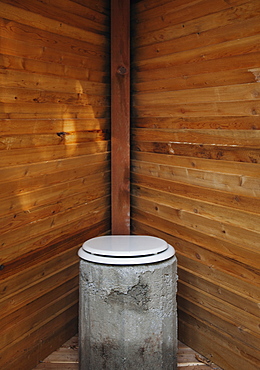 Toilet in wooden stall, California, California, USA