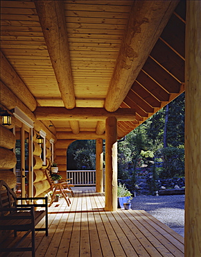 Log cabin porch, Vashon Island, Washington, USA