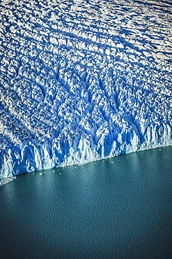 Aerial view of glacier's edge and water