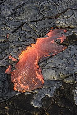 Molten lava glowing near dried lava, Big Island, Hawaii, USA