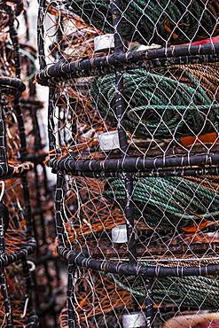 Crab and lobster pots stacked up on the quayside, close up