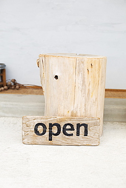 Close up of wooden Open sign in a vegetarian cafe, Kyushu, Japan