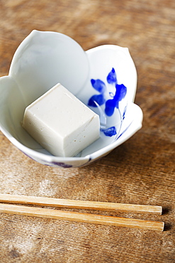 High angle close up of bowl of tofu on a table in Japanese restaurant, Kyushu, Japan