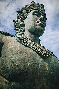 Low angle view of large stone statue of Hindu deity Vishnu, Indonesia