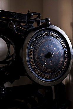 Close up of saddlery sewing machine in a saddler's workshop, Berkshire, United Kingdom