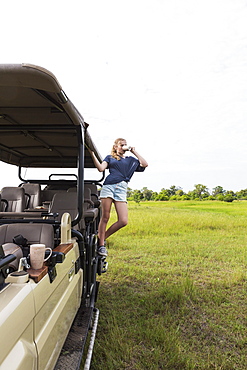 Thirteen year old girl on safari vehicle, Botswana