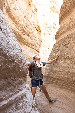 12 year old girl hiking in beautiful slot canyon Kasha Katuwe Tent Rocks, New Mexico