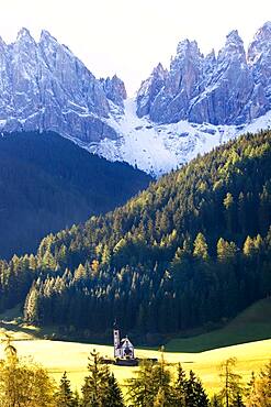 Saint John's Church in the Val di Funes surrounded by mountains, South Tyrol, Italy