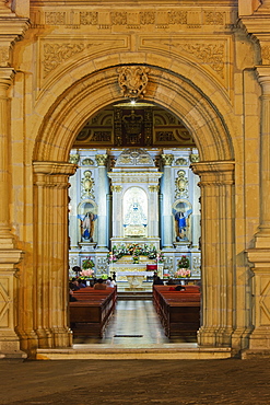 Arched entrance, door to an ornate church interior