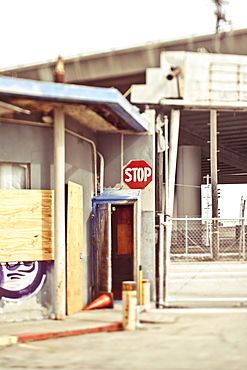 Stop sign at entrance to a factory or industrial plant