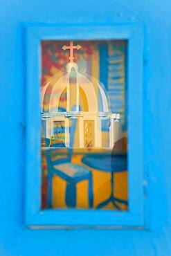 Reflection of church in picture window, Santorini, Cyclades Islands, Greece