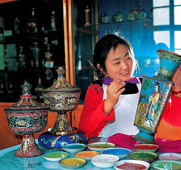 A cloisonn??? enamel craftsman at work