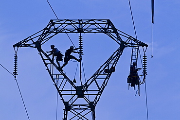 Workers on pylon, Brittany, France, Europe 